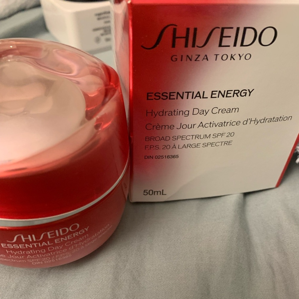 Shiseido essential energy day cream with box and Sisley eye cream